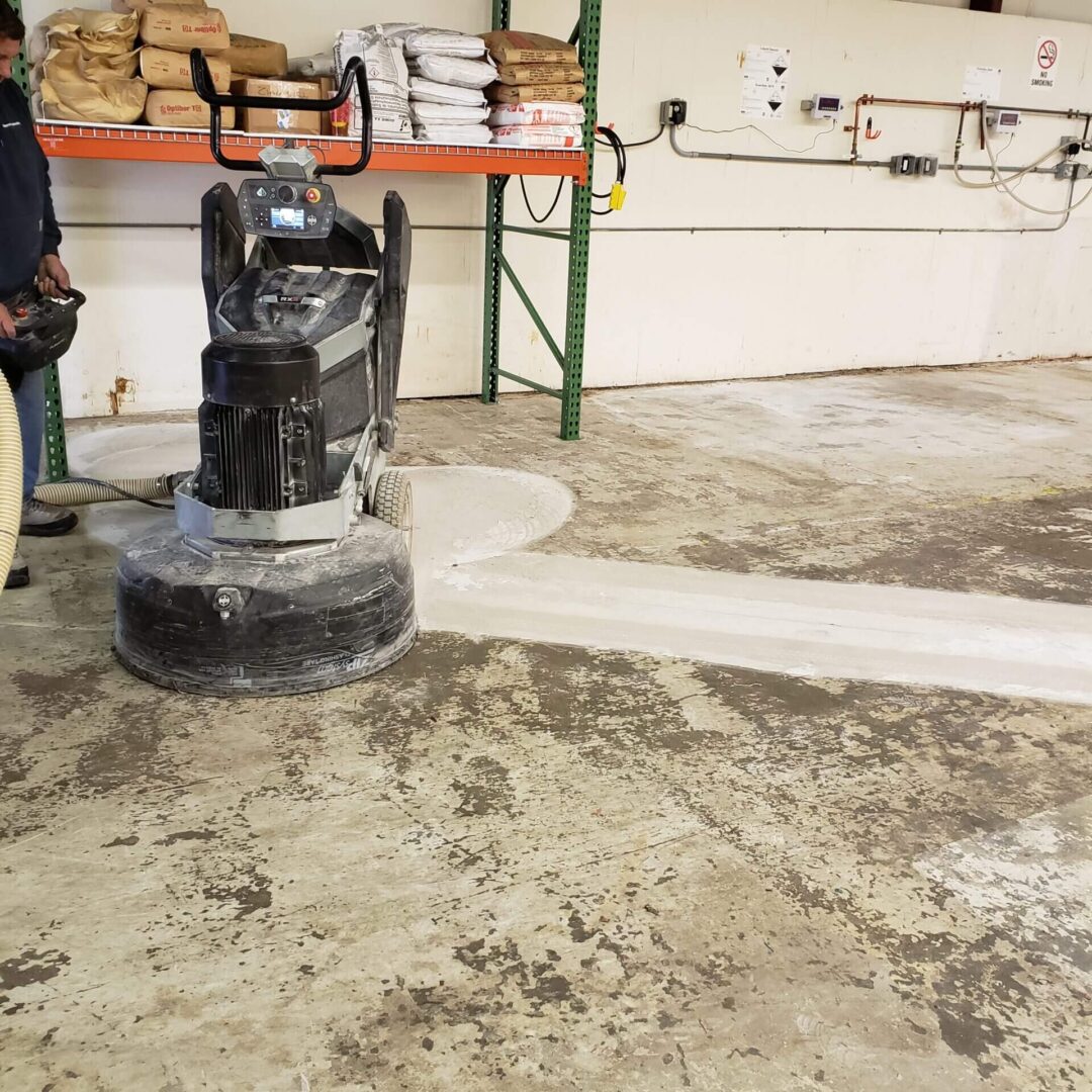 Grinder cleaning slab to prepare it for polishing