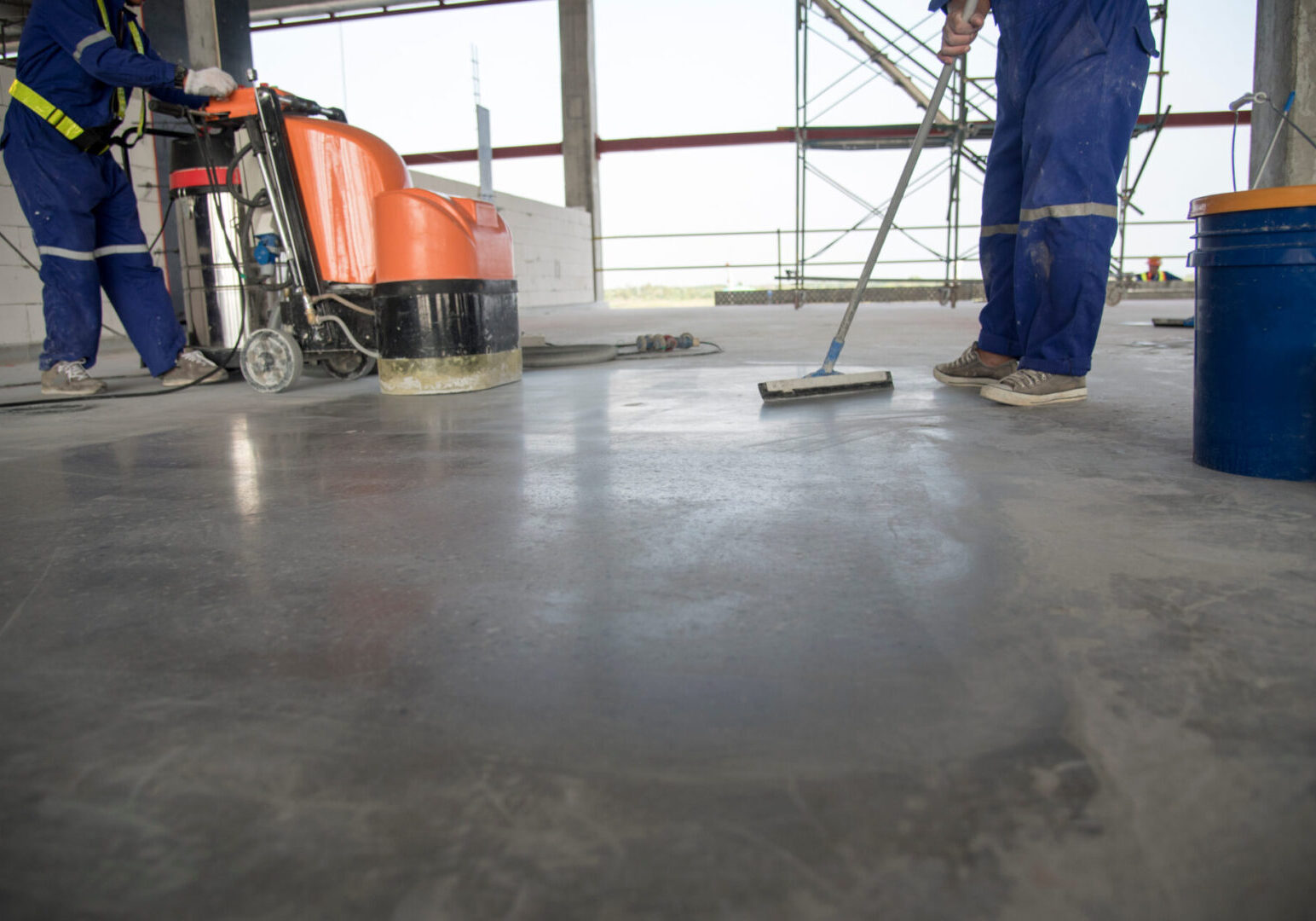 Reliance Concrete Polishing experts polishing the floor